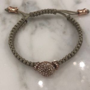 Tan and rose gold bracelet.